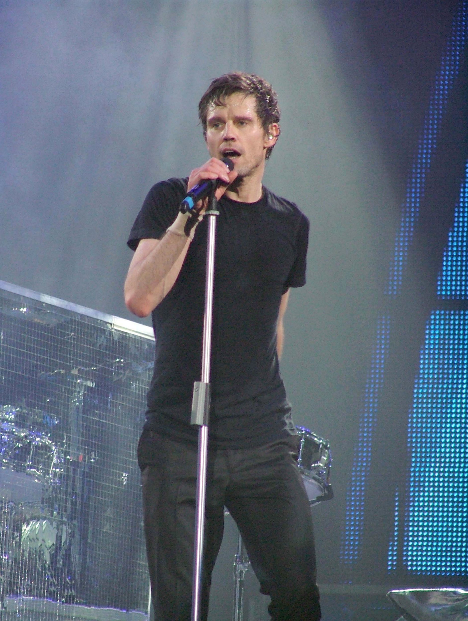 Jason Orange performs on stage